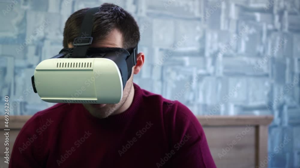 man in white vr glasses watching virtual reality man in white vr glasses watching virtual reality