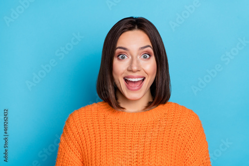 Portrait of attractive cheerful lucky amazed girl good incredible news reaction isolated over bright blue color background