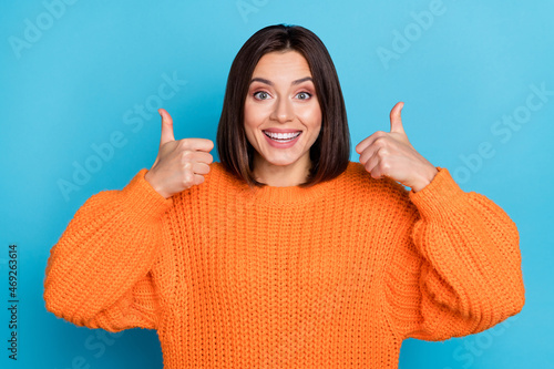 Fotografie Portrait of attractive funny cheerful girl showing double thumbup trust perfect