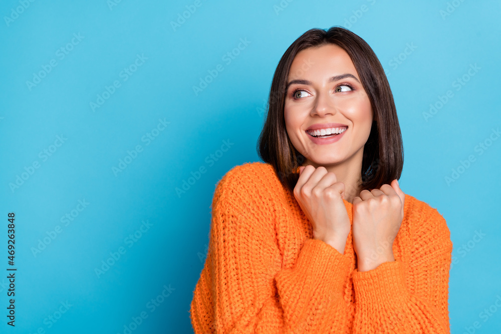 Portrait of attractive cheerful girl wearing soft wool clothes thinking copy space isolated over bright blue color background Portrait of attractive cheerful girl wearing soft wool clothes thinking copy space isolated over bright blue color background