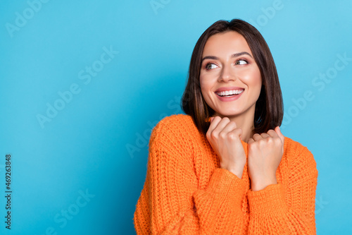 Portrait of attractive cheerful girl wearing soft wool clothes thinking copy space isolated over bright blue color background