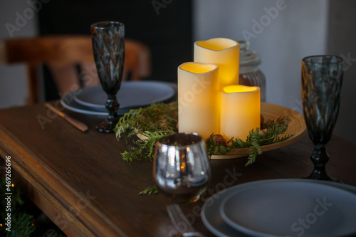Christmas wooden festive table with burning candles