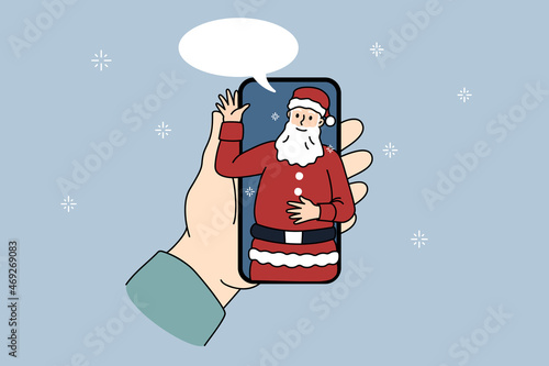 Person hold cellphone talk on video call with Santa Claus on home lockdown or quarantine. Speaking with Christmas father on virtual webcam event on smartphone. New Year. Vector illustration. 