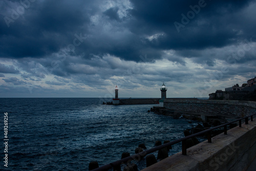 stormy entrance to Bastia port with lighthouse, Corsica , France .