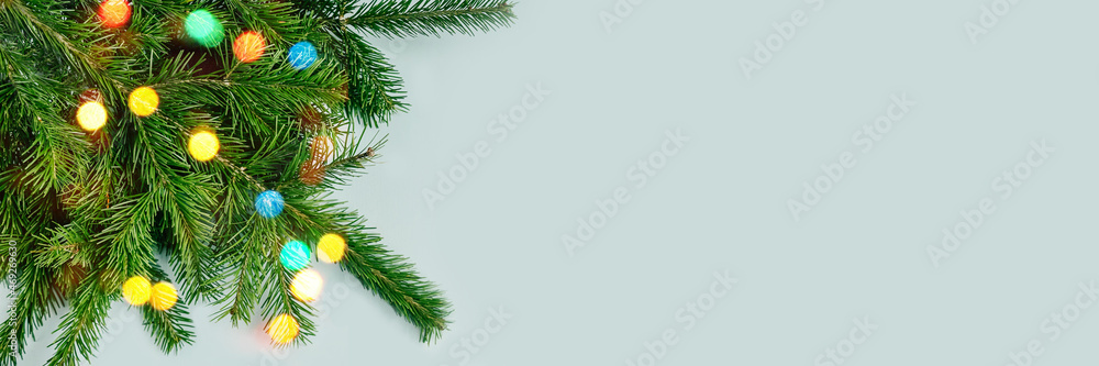 Fir tree branches on blue backgrund. Top view. Fir tree branches on blue backgrund. Top view.