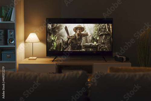 Adventure movie on a widescreen TV photo