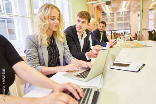 Students taking the test in the business assessment center