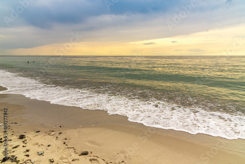 Fototapeta Naklejka Na Ścianę i Meble -  Seascape with incoming waves on the sandy shore.