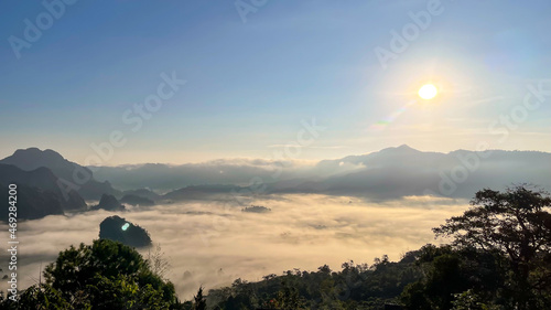 Dawn of the mountain with the sea of clouds. fog and cloud mountain  landscape. Beautiful Landscape of mountain layer in morning sun ray and winter fog.