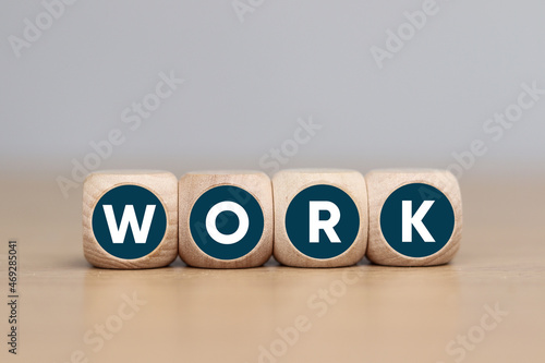 Wooden cube with WORK text, business concept © Sai