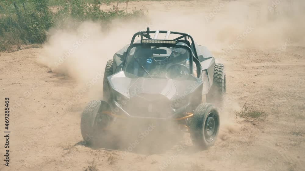A car is racing along the offroad track