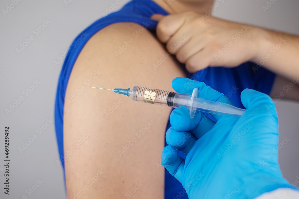 Concept. Chipping through vaccinations. Government conspiracy. Vaccination and implantation of a tracking microchip into the human body. Implantation of electronic technologies into the human body Concept. Chipping through vaccinations. Government conspiracy. Vaccination and implantation of a tracking microchip into the human body. Implantation of electronic technologies into the human body