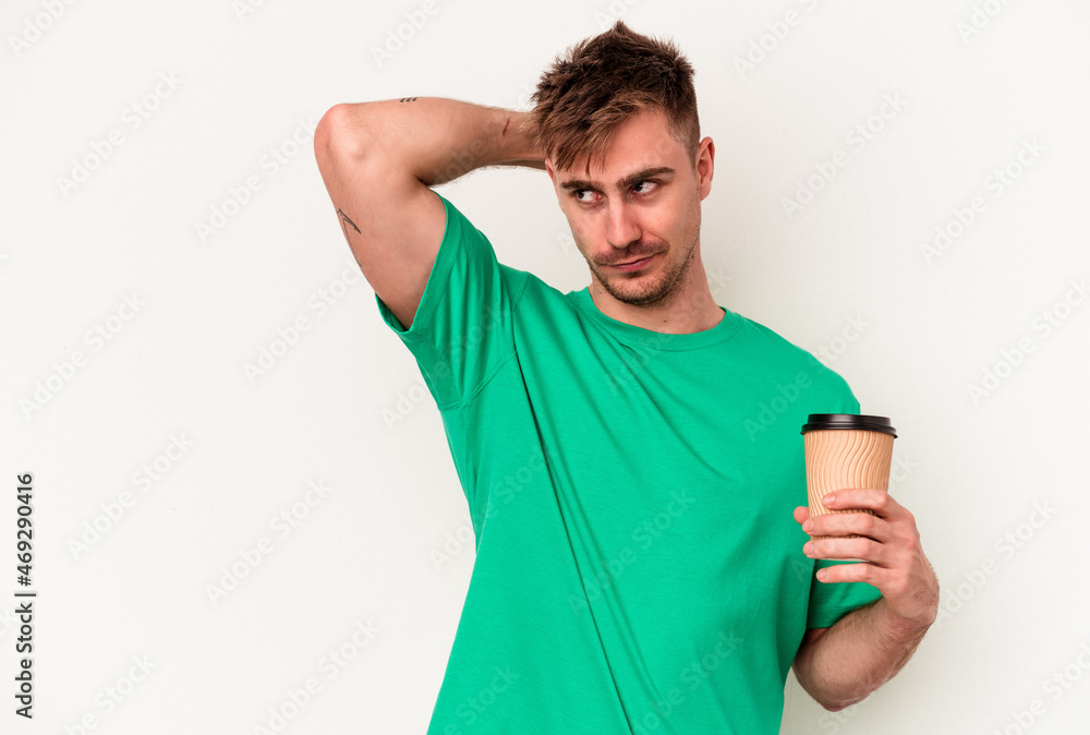 Young caucasian man holding a take away coffee isolated on white background touching back of head, thinking and making a choice. Young caucasian man holding a take away coffee isolated on white background touching back of head, thinking and making a choice.