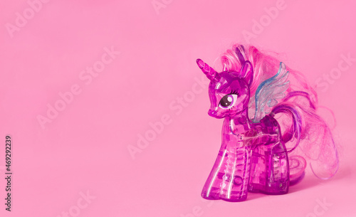 Lviv Ukraine -  11 11 2021: Children's toy my little pony purple twilight sparkle plastic on a pink background, cartoon for girls about unicorns