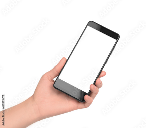 Smartphone with blank white display for advertising. Black smartphone in a female hand on a white background, isolate.