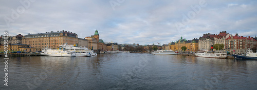 The bay Nybroviken a part of the larger bay Ladugårdsviken with commuting boats at the piers with hotels, offices and apartments an autumn day in Stockholm