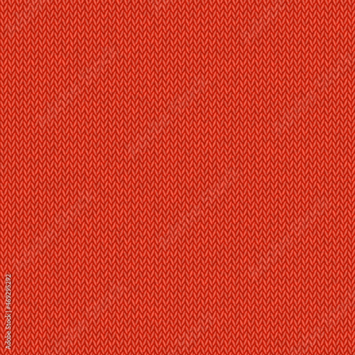 Knitted red background. Seamless knitted red christmas sweater texture.