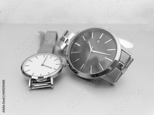 men and woman watch on grey background