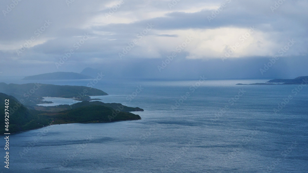 dark rain clouds over fjord in Norway