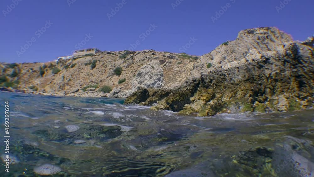 Split, a camera at sea level at the same time shows an underwater and surface rocky coastal landscape. Split, a camera at sea level at the same time shows an underwater and surface rocky coastal landscape.