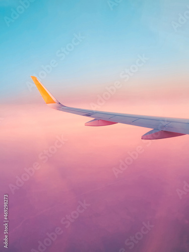 Surreal purple view from an airplane window, fantastic dream vacation flight, concept © Bogdan