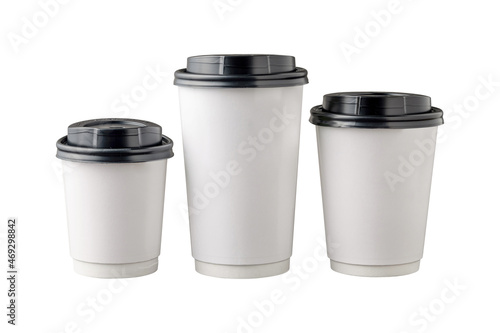 Three different sizes of white takeaway paper cups with black plastic lids isolated on white background.