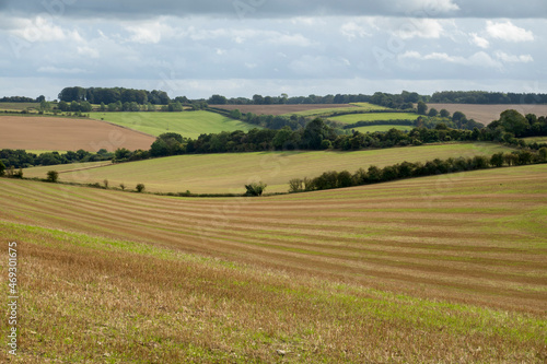 View over arable landscape with stubble field in foreground, East Garston, West Berkshire, England, UK