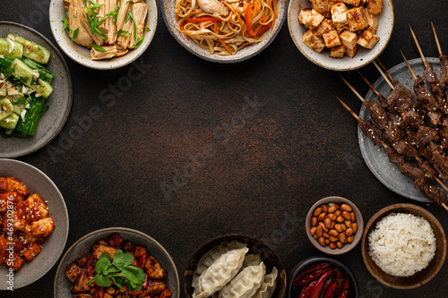 chinese food, chinese traditional cuisine dishes on dark background, top view, place for text