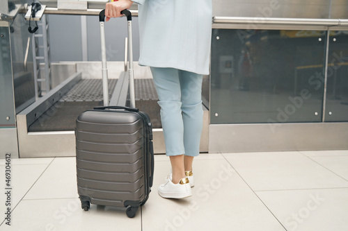 Caucasian passenger using self-service luggage drop-off system