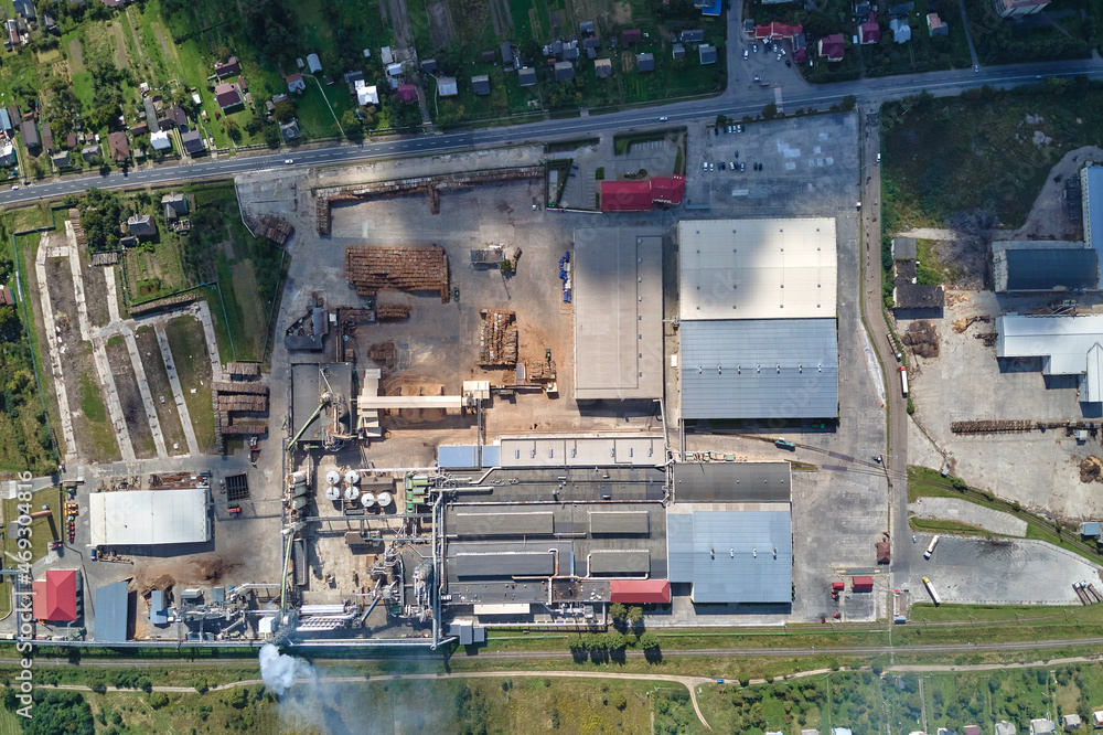 Aerial view of factory with high plant manufacture structure. Global production and manufacturing concept