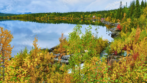 Fototapeta Naklejka Na Ścianę i Meble -  view on lake in nordic autumnally colored landscape