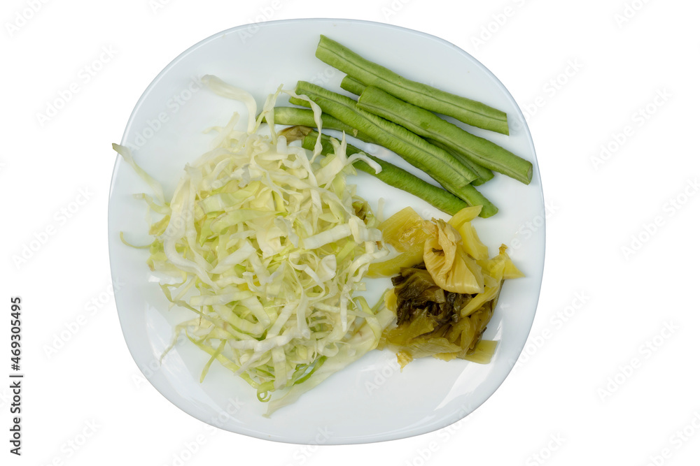 Vegetables on a white plate together with white cabbage,Pickled Cabbage and Lentils. on isolated white background. Vegetables on a white plate together with white cabbage,Pickled Cabbage and Lentils. on isolated white background.