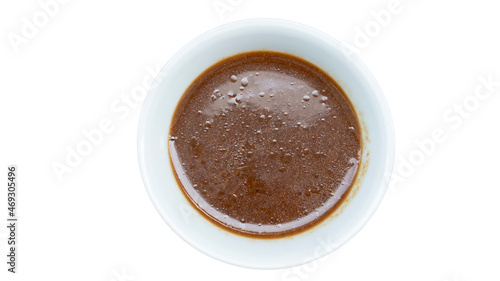 Above view of Sweet and Sour Soup with Duck. Inside white cup. On isolated white background with clipping path.