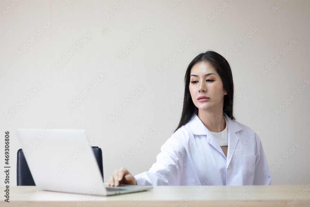 Healthcare and medical concept. Portrait Asian woman medical doctor and nurse working on laptop in hospital Healthcare and medical concept. Portrait Asian woman medical doctor and nurse working on laptop in hospital