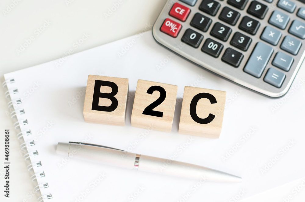 word B2C on wooden cubes. Concept with wooden blocks and calculator. B2C - Business-to-consumer. word B2C on wooden cubes. Concept with wooden blocks and calculator. B2C - Business-to-consumer.