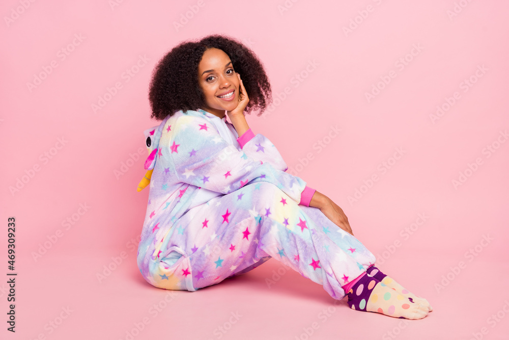 Full body profile side photo of young african girl wear warm overall bedtime isolated over pink color background Full body profile side photo of young african girl wear warm overall bedtime isolated over pink color background