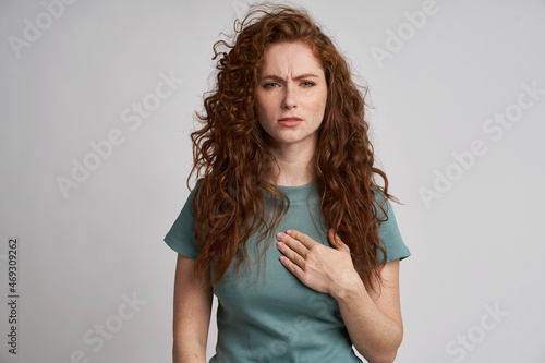 Young woman with pain of chest photo