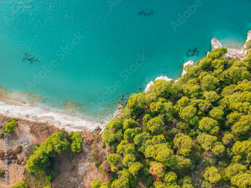 Aerial panoramic view over Milia beach in Skopelos island, against a cloudy sky in Sporades, Greece