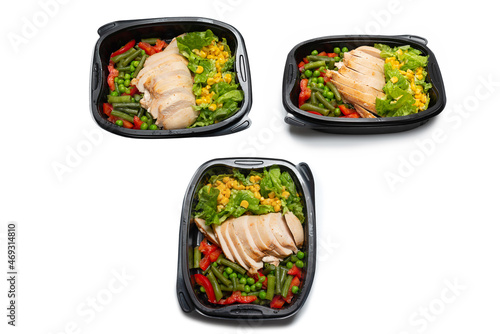 Ready food in a container. Stewed chicken, stewed vegetables.
