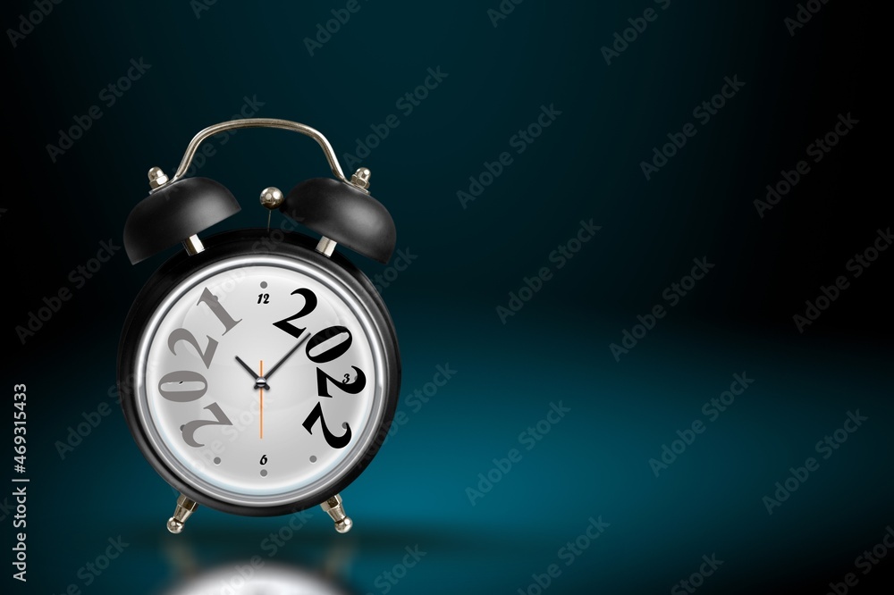 2021 and 2022 on the alarm clock. Merry Christmas and Happy new year concept. 2021 and 2022 on the alarm clock. Merry Christmas and Happy new year concept.
