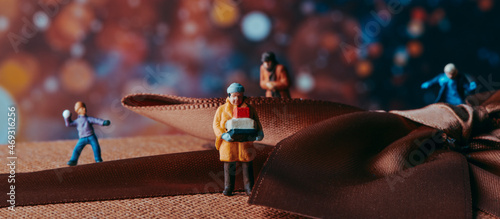 miniature people on a gift box, web banner © nito