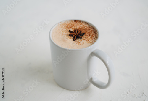A cup of Hot latte tea on white background photo