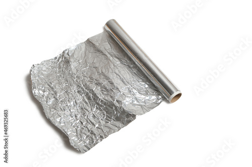 Roll of baking foil on white background.