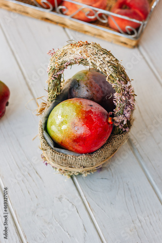 Ripe mango in a basket over...