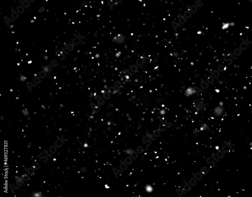 Snow falling on black background
