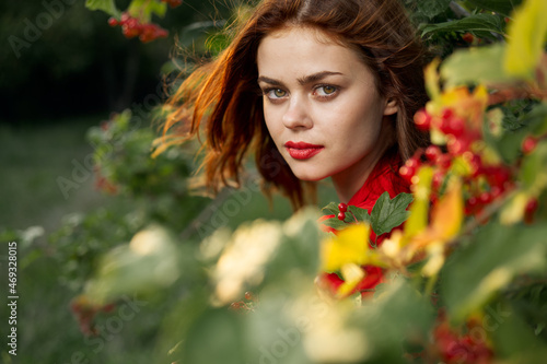 beautiful woman bush with berries nature fresh air