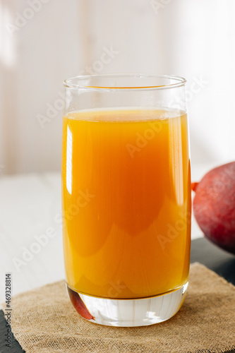 Mango juice in a glass, fre...