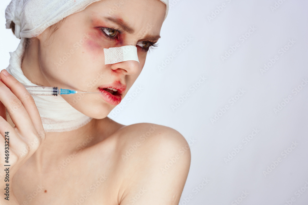 emotional woman with bandaged face bruises syringe in hand painkillers isolated background emotional woman with bandaged face bruises syringe in hand painkillers isolated background