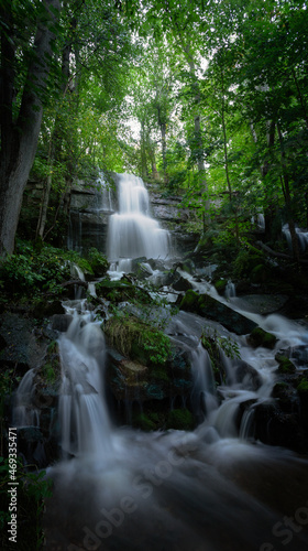 Small hidden waterfall in autumn on the mountain Kinnekulle in Sweden