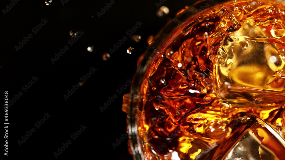 Top shot of whisky glass with ice cubes, closeup. Top shot of whisky glass with ice cubes, closeup.